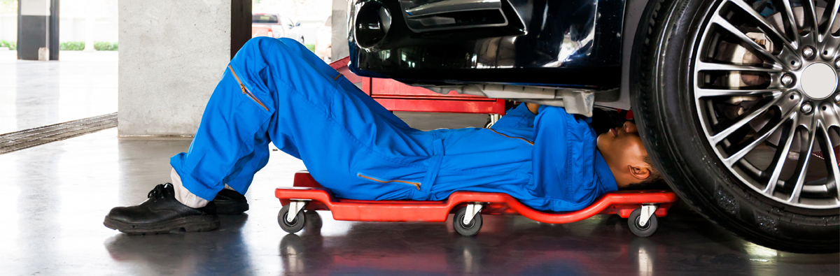 Mechanic under a vehicle - Car Repairs Northampton