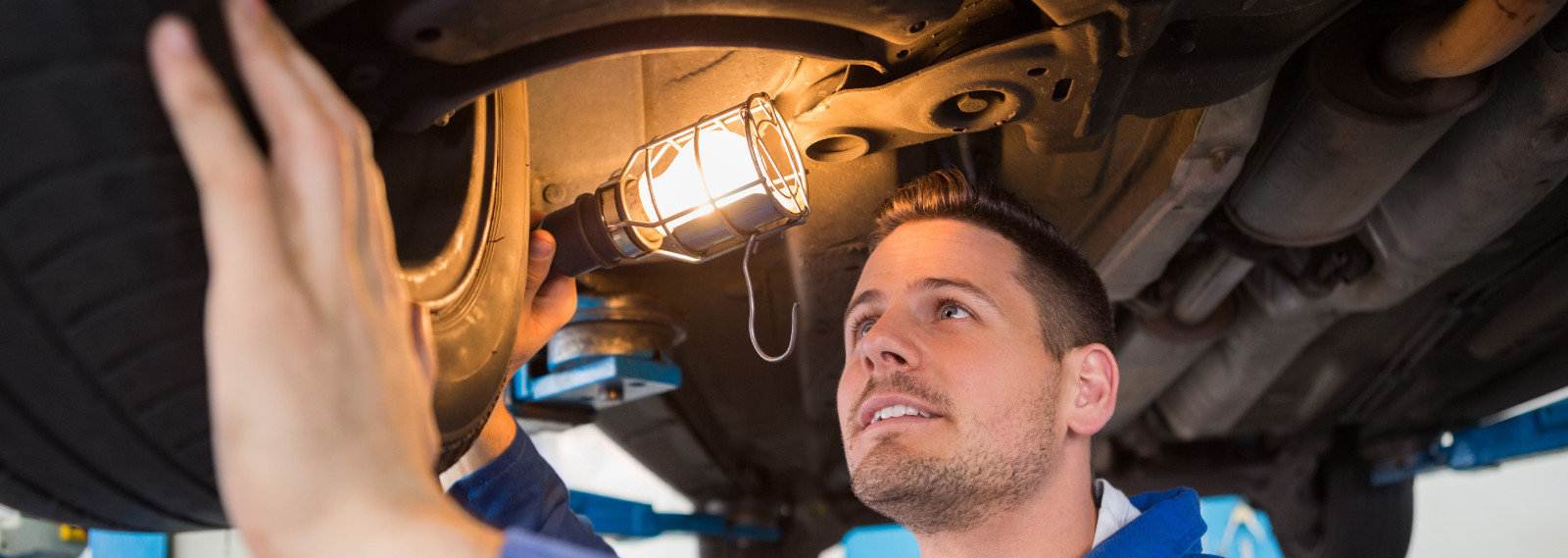 Mechanic checking an MOT under a vehicle - MOT Northampton